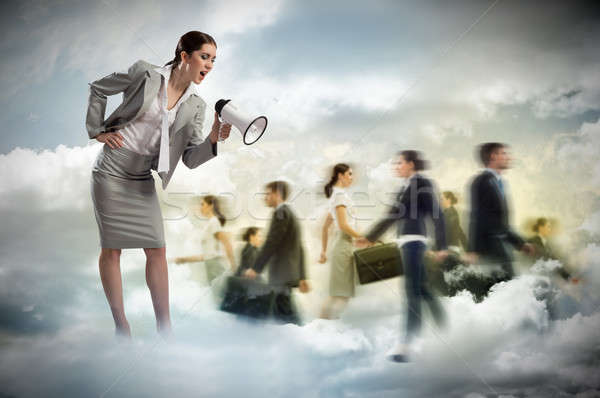 woman shouting into a megaphone at the crowd Stock photo © adam121