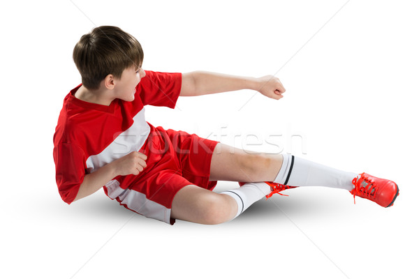 Tineri fotbalist băiat roşu uniforma Imagine de stoc © adam121