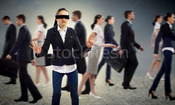 confused blindfolded woman on a white background Stock Photo