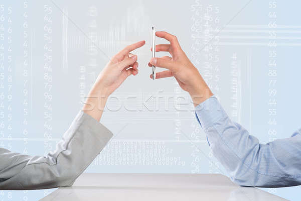 Werken cohesie zakenlieden handen mobiele telefoon Stockfoto © adam121