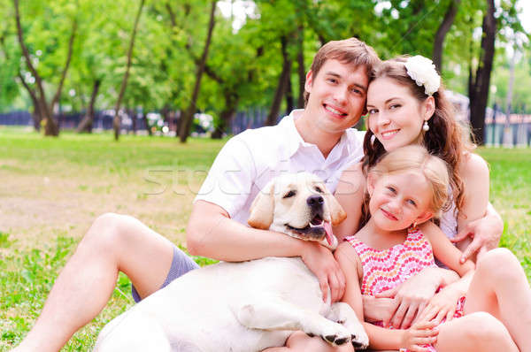Boldog fiatal család labrador pihen park Stock fotó © adam121