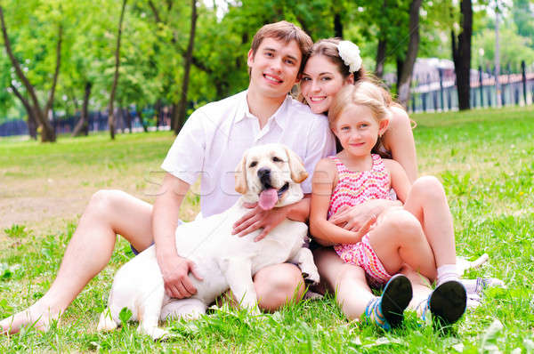 Happy young family with Labrador Stock photo © adam121