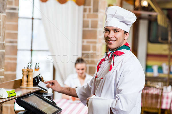 cook inserts the card into a computer terminal Stock photo © adam121