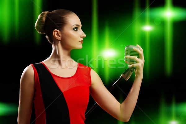 çekici kadın şarkıcı mikrofon arkasında soyut moda Stok fotoğraf © adam121