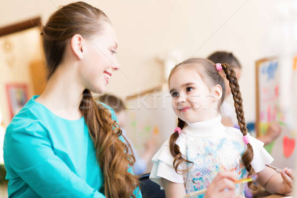 teacher talks to a schoolgirl Stock photo © adam121