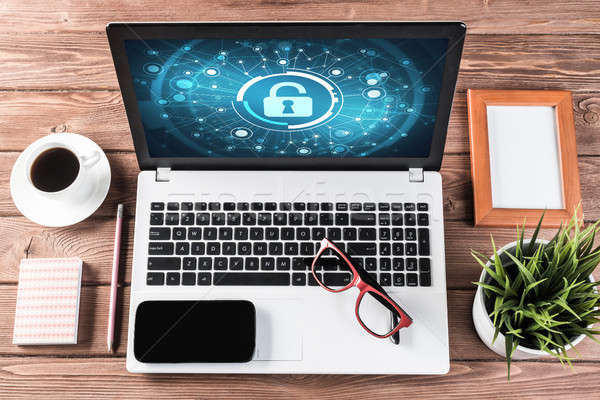 Stock photo: Web security and technology concept with laptop on wooden table