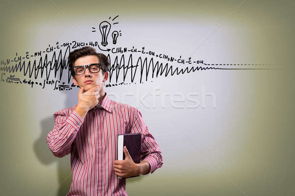 young man scientist with glasses thinking Stock photo © adam121