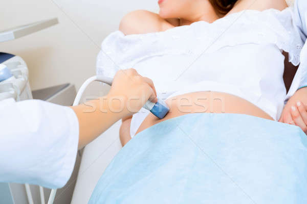 close-up of hands and abdominal ultrasound scanner Stock photo © adam121