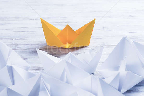 Business leadership concept with white and color paper boats on  Stock photo © adam121