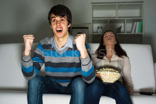 Cara paixão assistindo tv adormecido namorada Foto stock © adam121