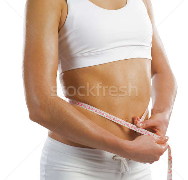 young athletic woman measuring waist Stock photo © adam121