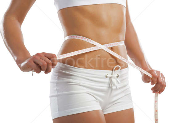 young athletic woman measuring waist Stock photo © adam121