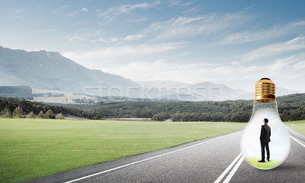 Zakenman binnenkant gloeilamp jonge gevangen asfalt Stockfoto © adam121