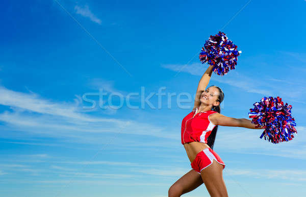 Young cheerleader in red costume with pampon Stock photo © adam121