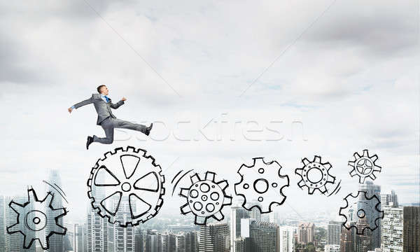 Empresário saltando alto jovem cidade corrida Foto stock © adam121