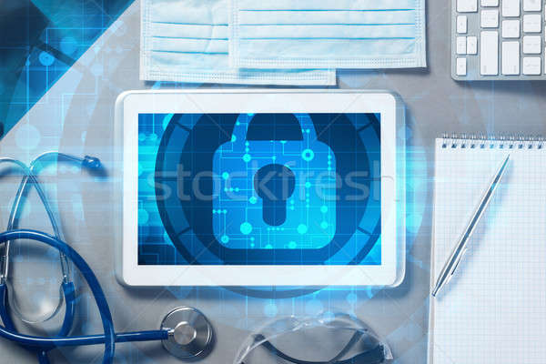 Top view of doctor workplace with tablet pc and medicine tools on wooden table Stock photo © adam121