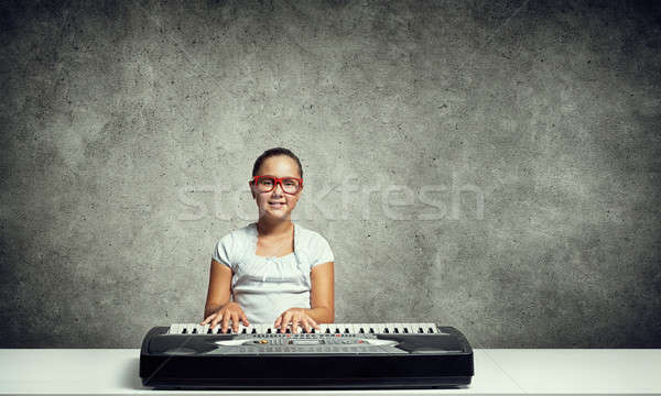 Kid girl play synthesizer Stock photo © adam121