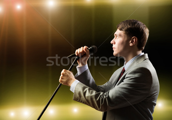 Businessman with microphone Stock photo © adam121