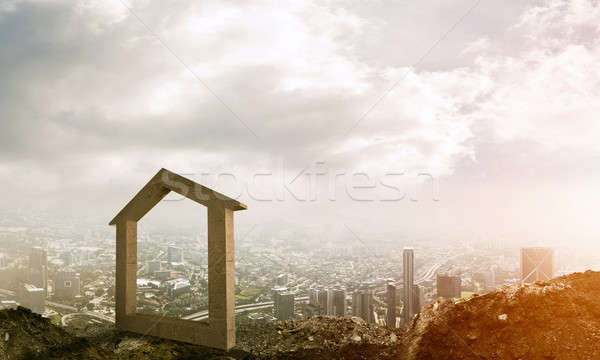 Conceptual image of concrete home sign on hill and natural lands Stock photo © adam121