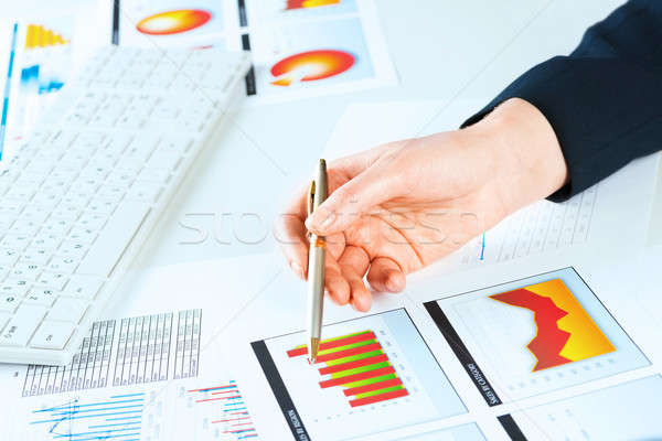 female hand pointing to the financial growth chart Stock photo © adam121