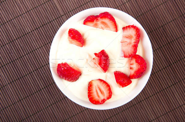 strawberries with cream on bamboo tablecloth Stock photo © adam121