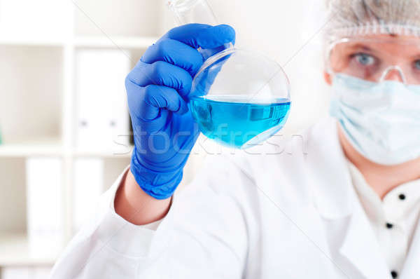 female chemist mixing liquids in test tubes Stock photo © adam121