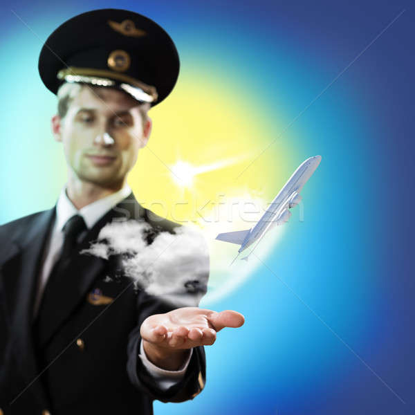 pilot in the form of extending a hand to airplane Stock photo © adam121