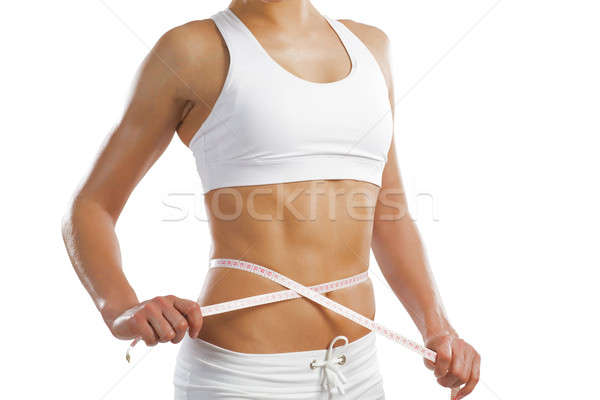 young athletic woman measuring waist Stock photo © adam121