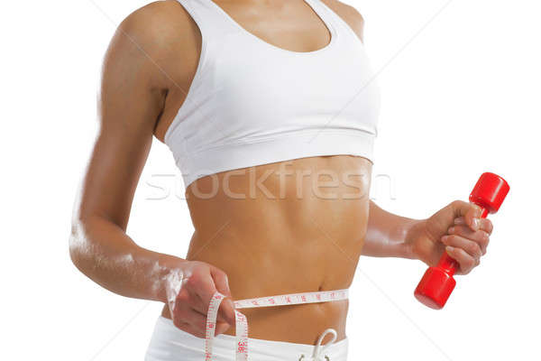 young athletic woman measuring waist Stock photo © adam121