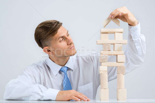 Businessman making tower Stock photo © adam121