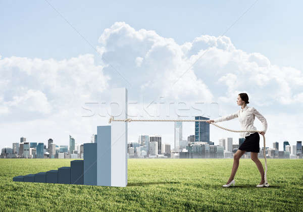 Businesswoman pulling arrow with rope and making it raise up Stock photo © adam121