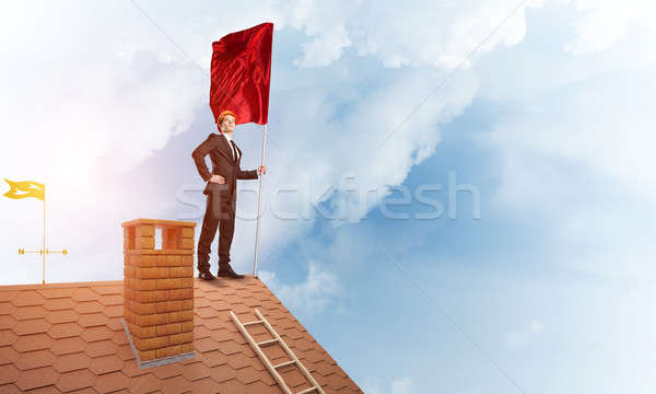 Young businessman with flag presenting concept of leadership. Mixed media Stock photo © adam121