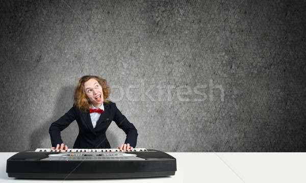 Mad woman play piano Stock photo © adam121