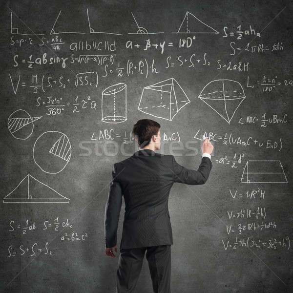 Stock photo: Man writing on blackboard