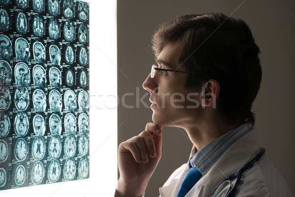 male doctor looking at the x-ray image Stock photo © adam121