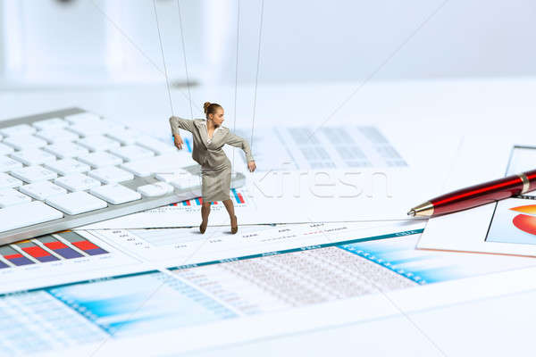 businesswoman puppet doll is on the desk Stock photo © adam121