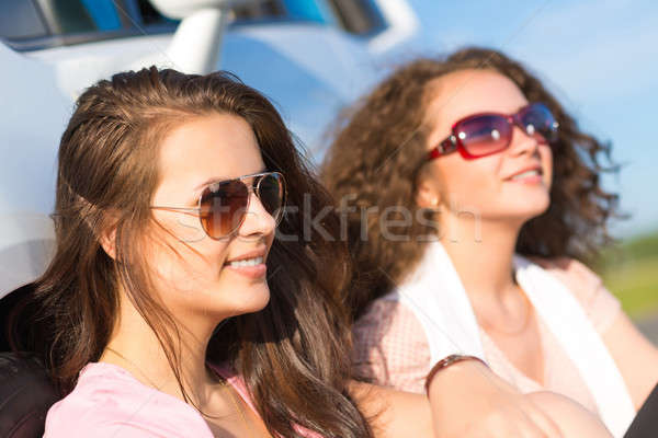 Two attractive young women wearing sunglasses Stock photo © adam121