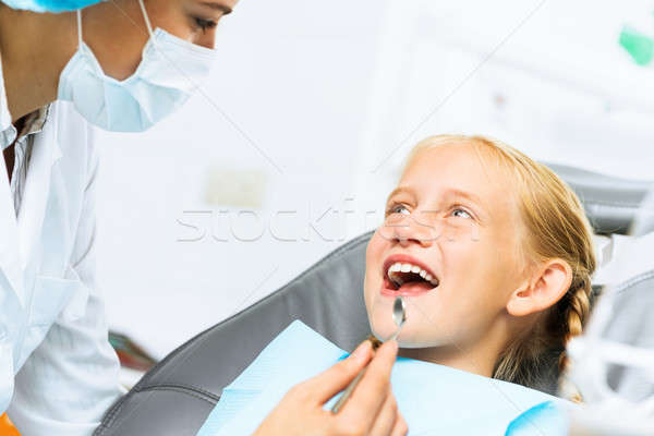 Dentist inspecting patient Stock photo © adam121