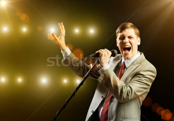 Businessman with microphone Stock photo © adam121