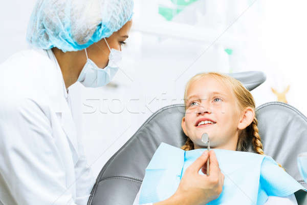 Dentist inspecting patient Stock photo © adam121