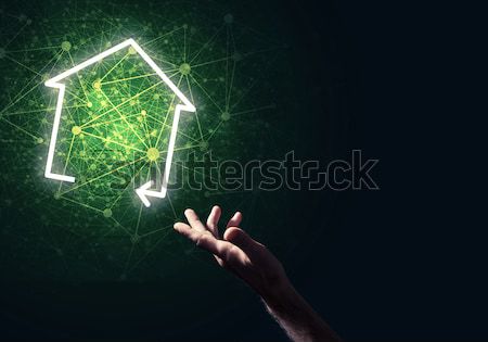 Conceptual image with hand pointing at house or main page icon o Stock photo © adam121