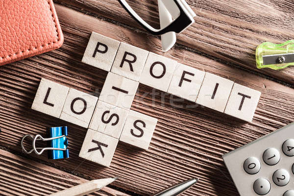 Profit loss and risk words on workplace collected of wooden cubes Stock photo © adam121