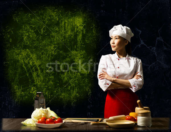 Asian female chef looking at the empty space Stock photo © adam121