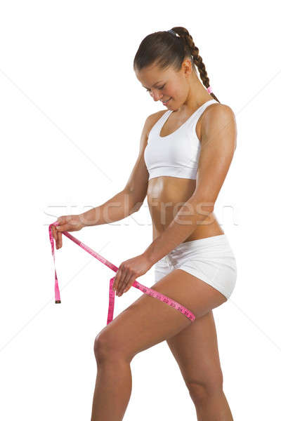 athletic woman measuring thigh Stock photo © adam121