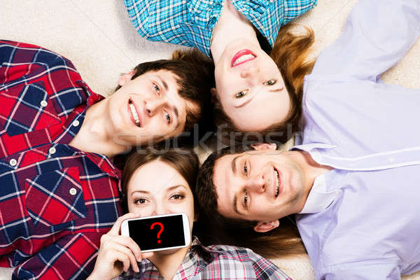 Quatro jovens mentir juntos jovem mulher atraente Foto stock © adam121
