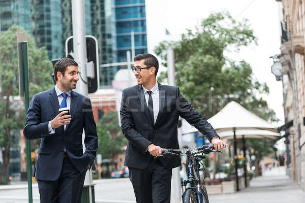 Сток-фото: два · бизнесменов · ходьбы · говорить · ходьбе · велосипед
