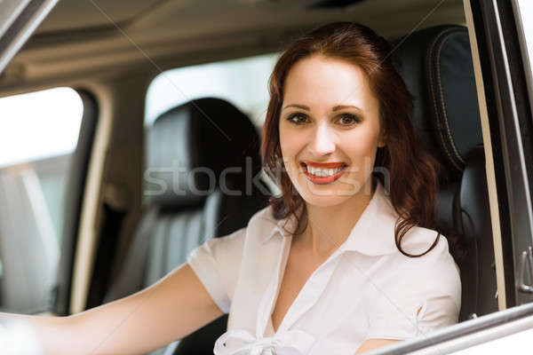 若い女性 新しい車 ショールーム 笑みを浮かべて 見える カメラ ストックフォト © adam121