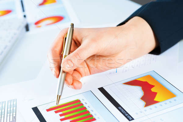 female hand pointing to the financial growth chart Stock photo © adam121