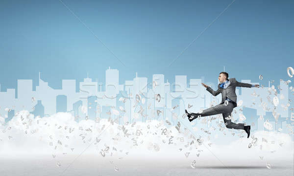 Stock photo: Businessman jumping high