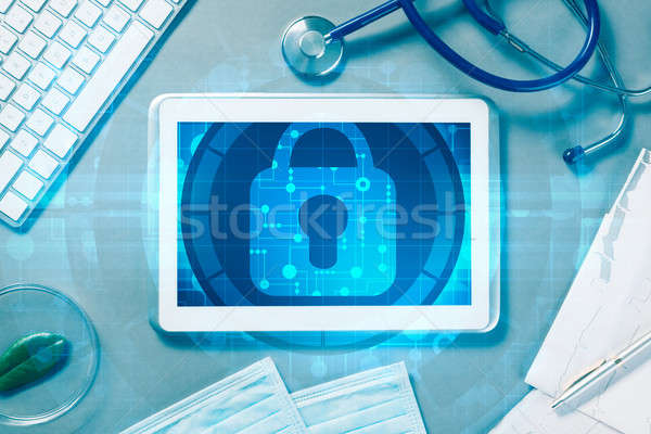 Top view of doctor workplace with tablet pc and medicine tools o Stock photo © adam121